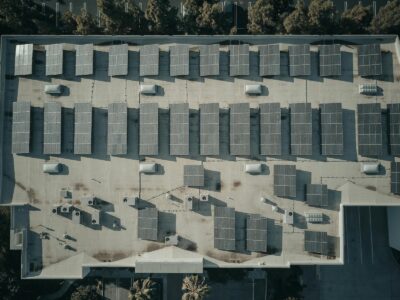 Discover the efficiency of solar energy with this aerial shot of solar panels on a rooftop.